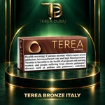 TEREA Bronze Italy pack on TEREA Dubai gold-green podium with clear nicotine health warning
