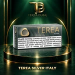 TEREA Silver Italy pack on TEREA Dubai gold-green podium with clear nicotine health warning