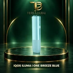 IQOS ILUMA i ONE Breeze Blue device on a TEREA Dubai green and gold display