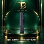 IQOS ILUMA i ONE Midnight Black all-in-one device on a TEREA Dubai green and gold display