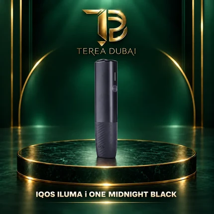 IQOS ILUMA i ONE Midnight Black all-in-one device on a TEREA Dubai green and gold display