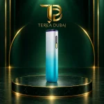 Silver-to-turquoise IQOS ILUMA i ONE REMIX device with purple cap and yellow button below a gold TEREA Dubai logo